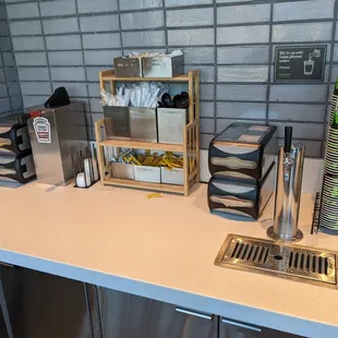 Condiments, napkins, utensils, and cups