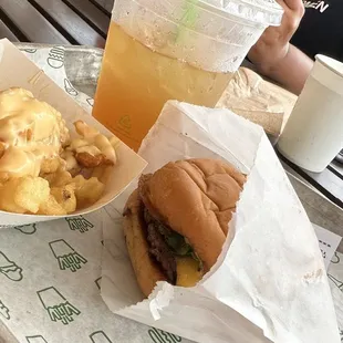 a burger and fries on a tray