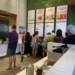 people standing in line at counter