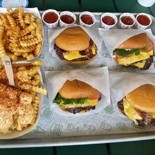 Top row: Spicy Fries with Ranch, double SmokeShack, double Shack Stack Bottom row: Spicy Cheese Fries with Ranch, Shack Stack, SmokeShack