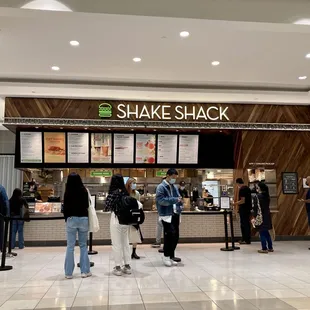 people standing in line at the counter