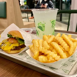 a burger and fries on a tray