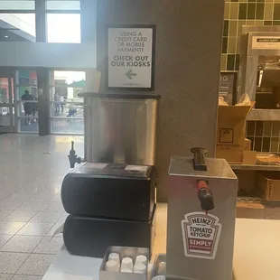 Sign that kiosks are available for faster check out-wish I saw this while I was waiting in line