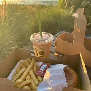 Cheeseburger on gluten free bread, fries and chocolate shake