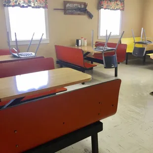 empty desks and chairs in a classroom