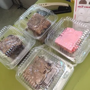 a variety of desserts in plastic containers