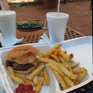 a burger and fries on a tray