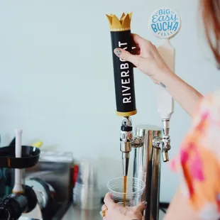a woman pouring a drink
