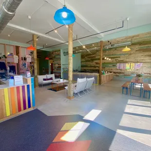 a brightly lit room with colorful furniture