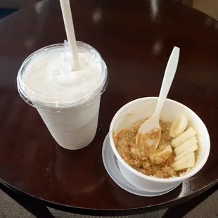a bowl of cereal and a cup of yogurt