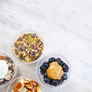 a variety of desserts in plastic containers