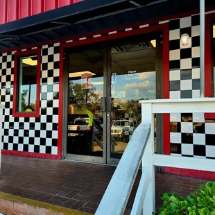 Jan 2023: The front door w/ restaurant times