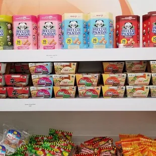 a shelf full of snacks and candy