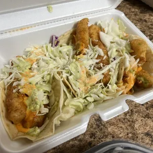 a taco in a styrofoam container
