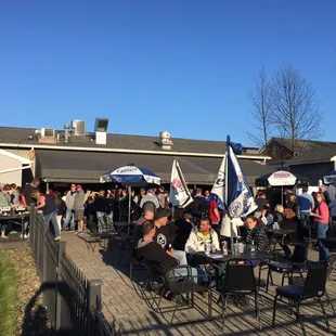 a crowd of people sitting outside