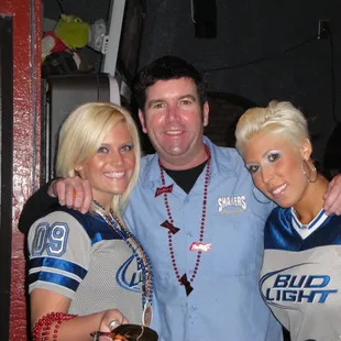 a man and two women posing for a picture