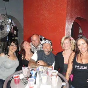 a group of people sitting at a table