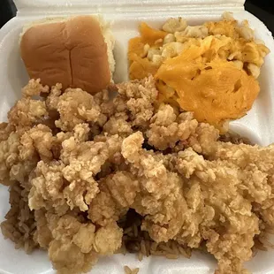 Cracked conch with mac &amp; cheese and rice &amp; peas.