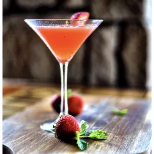 a strawberry martini on a cutting board