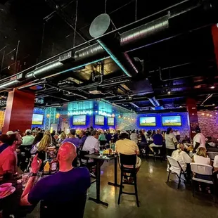 a large group of people sitting at tables