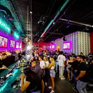 a crowd of people at a bar