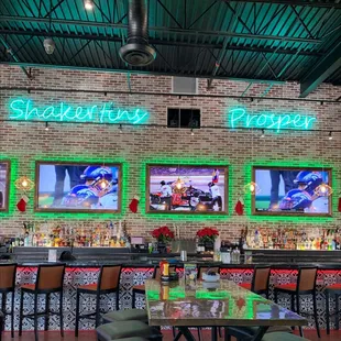 a bar with neon signs