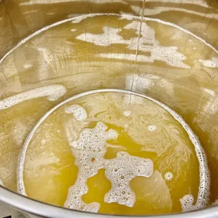 a pot full of boiling wine