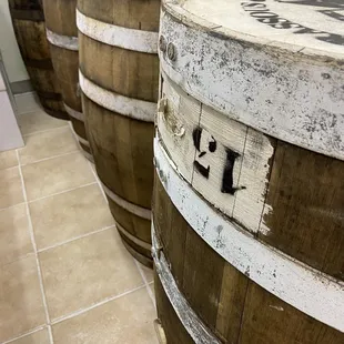 a row of wooden barrels with the names shakespeare on them