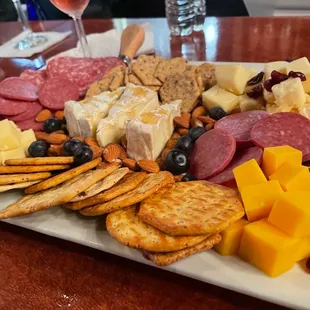 a platter of cheese and crackers