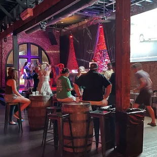 a group of people sitting at a bar