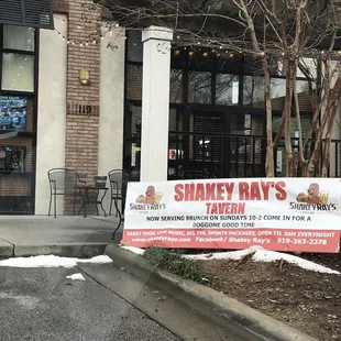 a sign for shakey ray&apos;s tavern