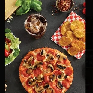 a pizza with pepperoni, mushrooms, and cheese