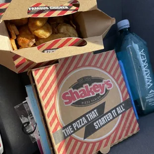 a box of doughnuts and a bottle of water