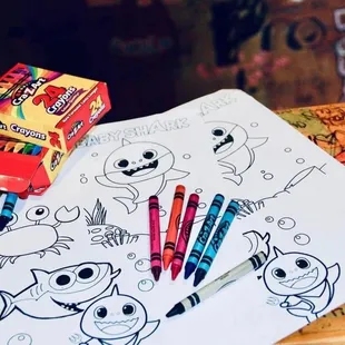 two crayons and a box of crayons