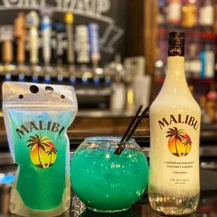 two cocktails on a bar