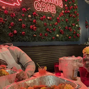 a man sitting at a table with food