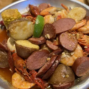 Seafood boil : crawfish, sausage, shrimp, corn, and potatoes.
