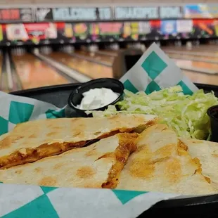 a tortilla with a side of coleslaw