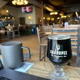 a glass of beer and a laptop