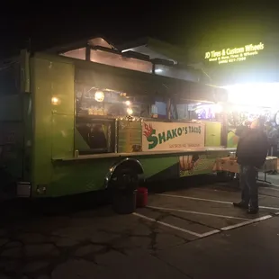 It's a green truck in the parking lot of JD tires &amp; custom wheels