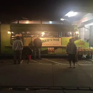 people standing in front of a food truck