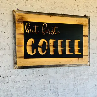 a sign on a brick wall