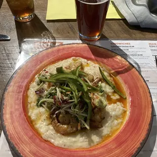 Shrimp over risotto and bed of jalapeño slaw.
