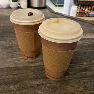 Coffee and latte served with a little chocolate treat