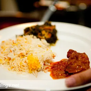 Rice, chicken curry, and palak paneer