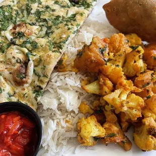 Aloo Gobhi, Garlic Naan Bread, Vegetable Samosas with onion chutney