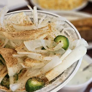 a person holding a plate of food