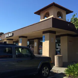 a car parked in front of a restaurant
