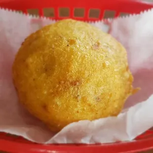 a fried donut in a basket