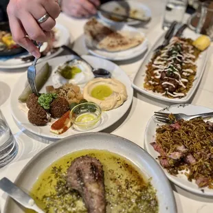 Lunch feast: lamb chops, Shalom plate, chicken kebab, shakshuka, rice, pita